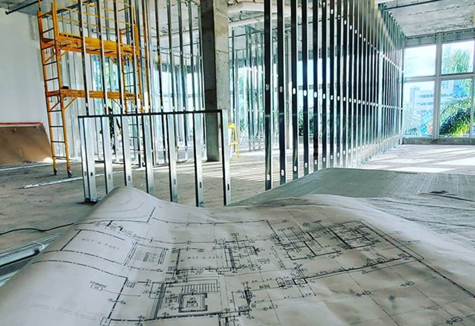 Metal framing installed around a set of construction plans